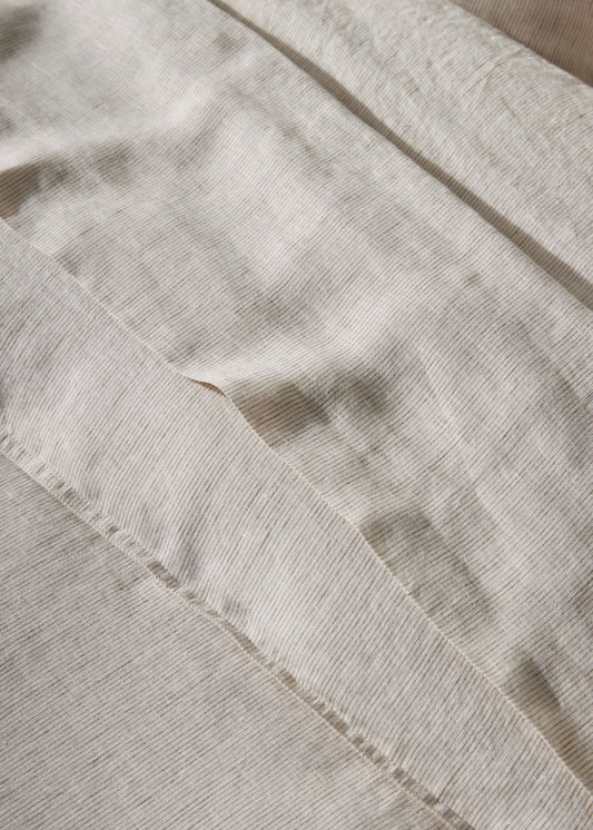 Close-up of beige fabric with a textured pattern
