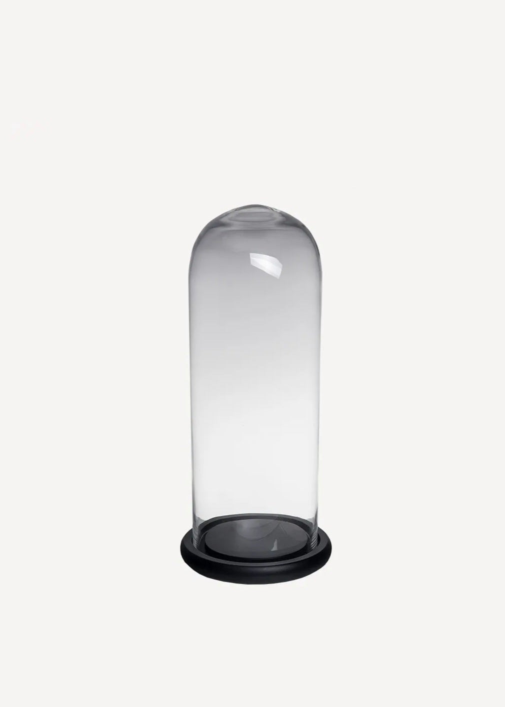Clear glass dome with black base on a white background