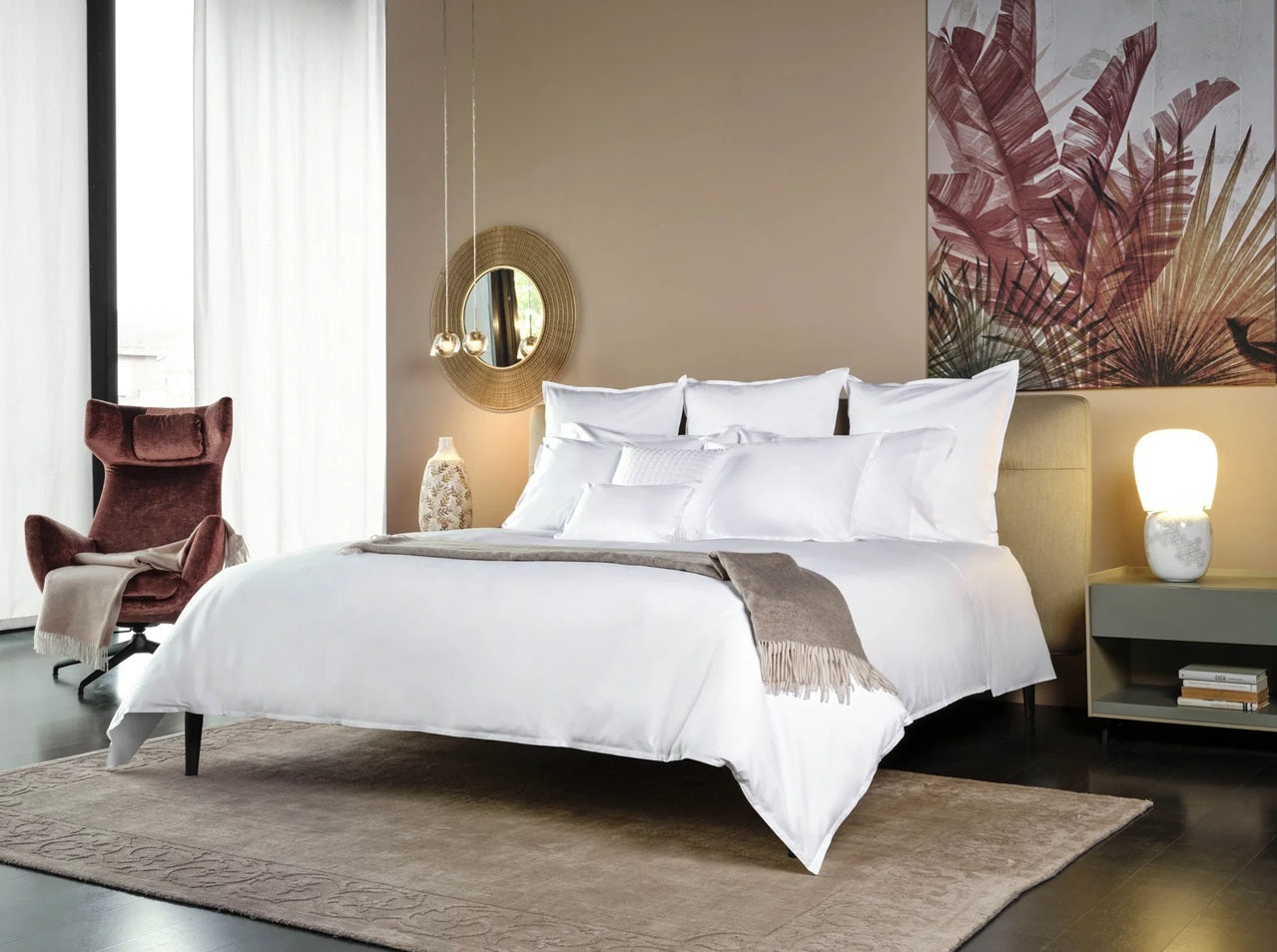 Modern bedroom with a bed, chair, and decorative elements.