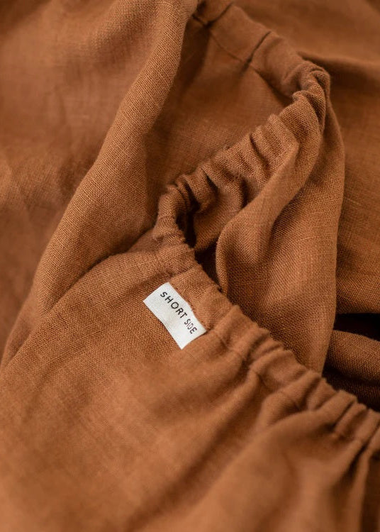Brown fabric with a brand label on a close-up shot