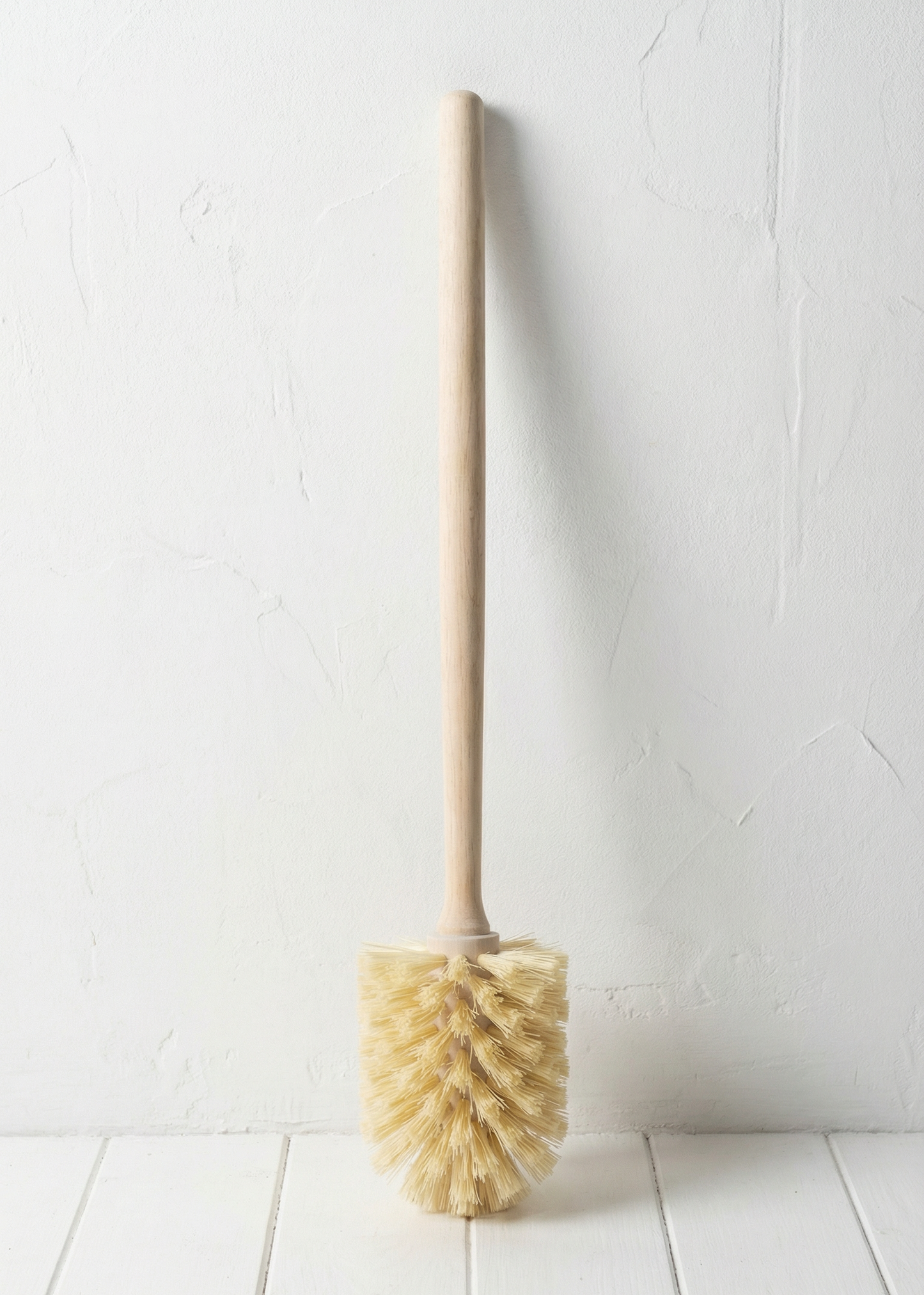 Bottle brush with natural bristles on a white background