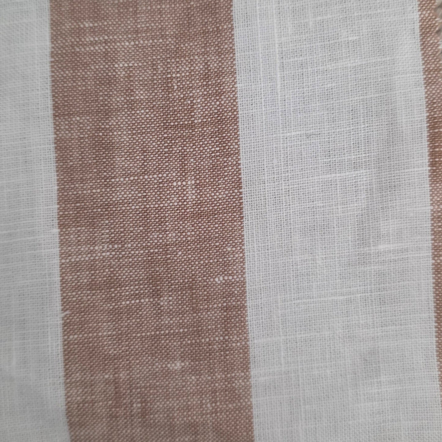 Textile sample with a label on a textured surface