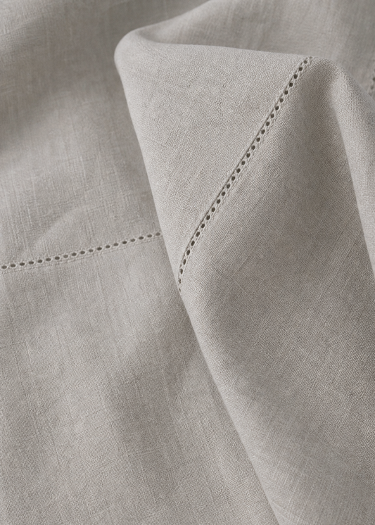 Close-up of light gray fabric with a subtle pattern