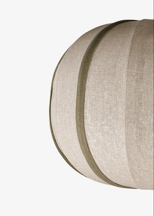 Close-up of a textured cylindrical object with concentric circles on a white background