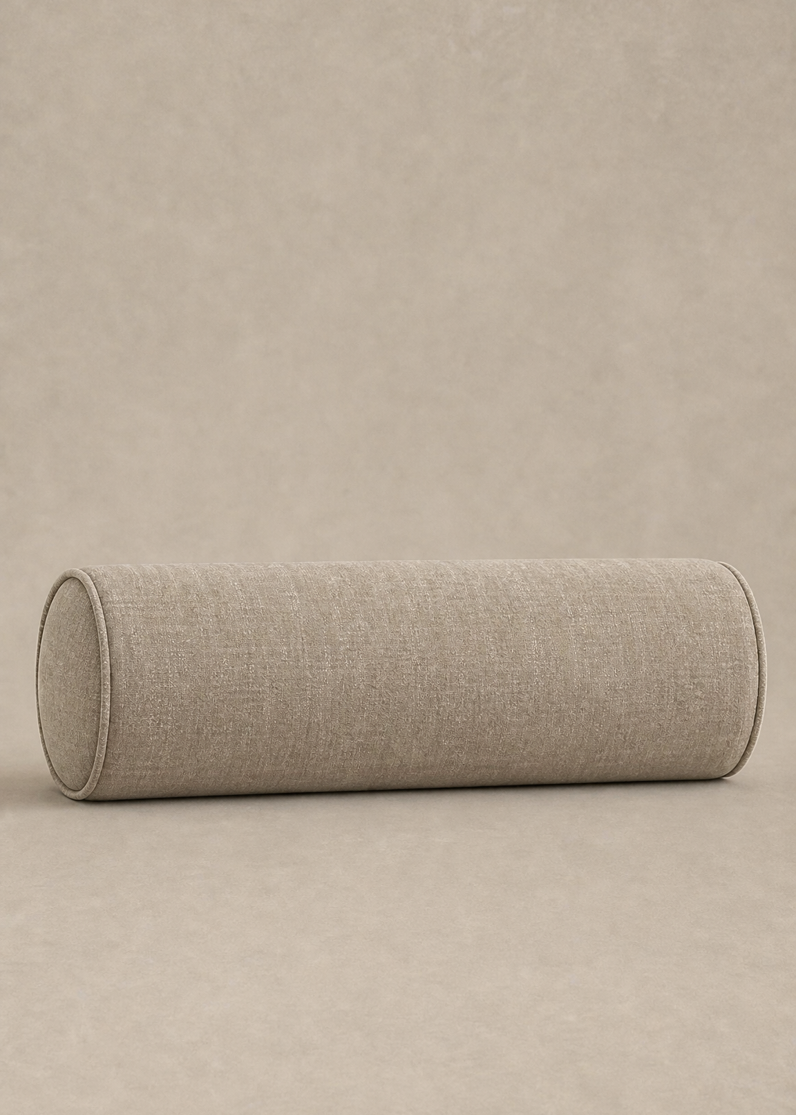 A cylindrical floor cushion with a textured beige linen fabric, shown on a matching neutral beige background.