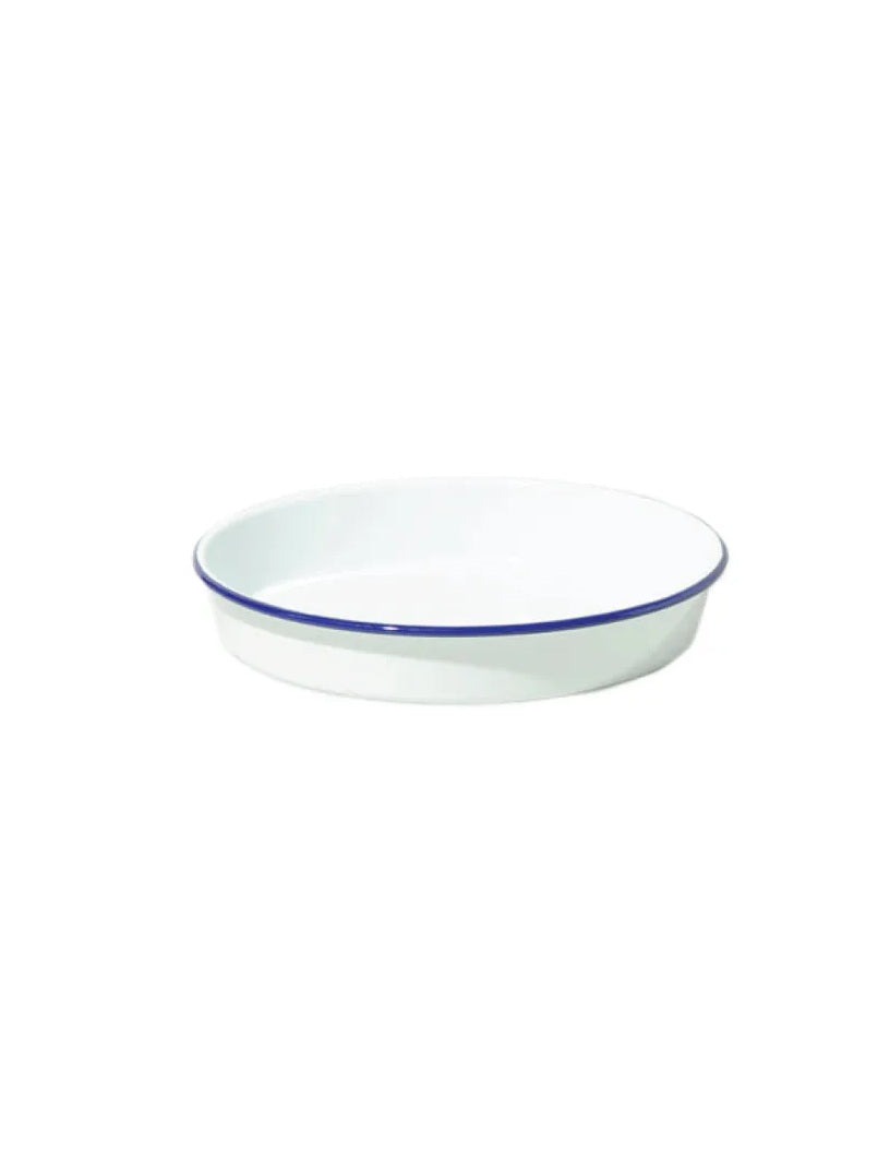 A white round enamel deep pan with a blue rim.