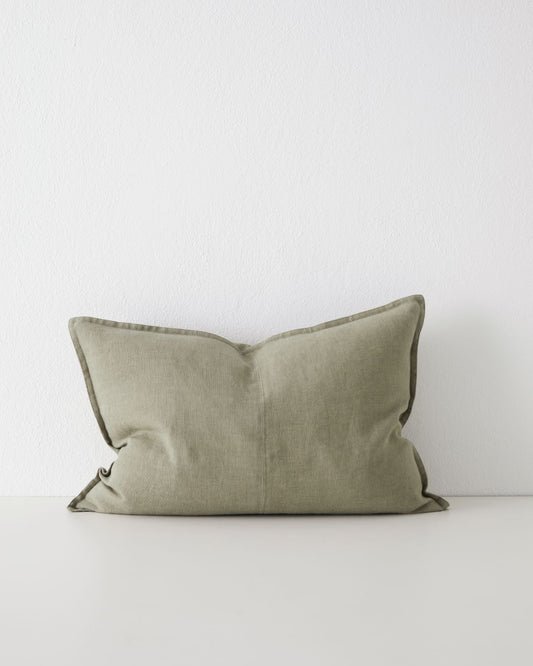 A caper green rectangular linen cushion with a double stitch French seam edge and a flat, woven texture.