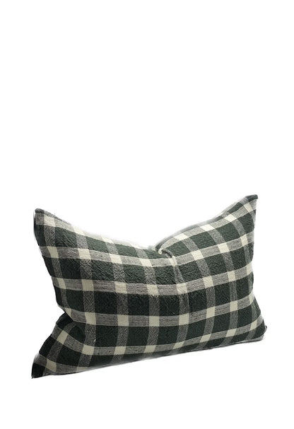 Black and white checkered pillow on a white background