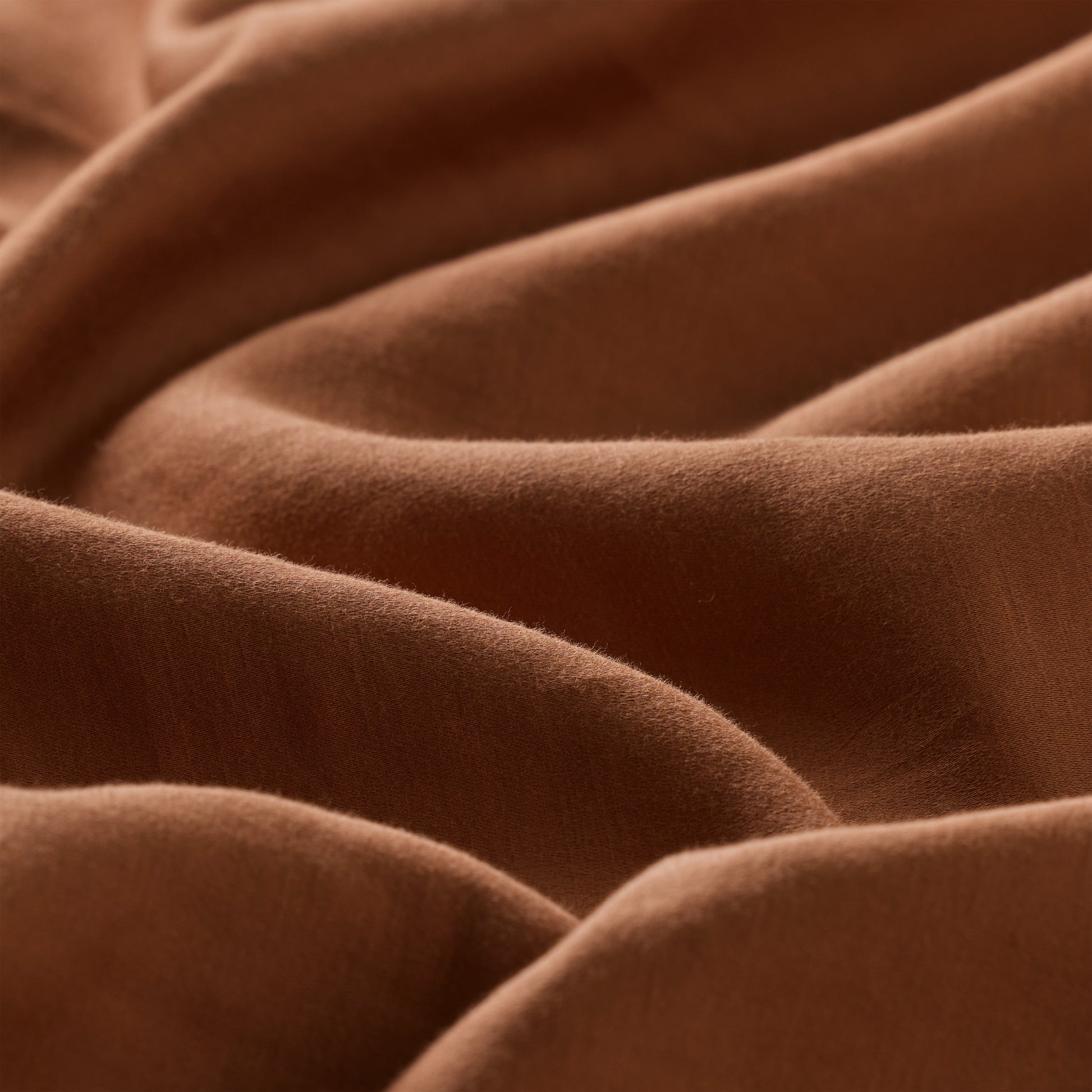 Close-up of brown fabric with folds