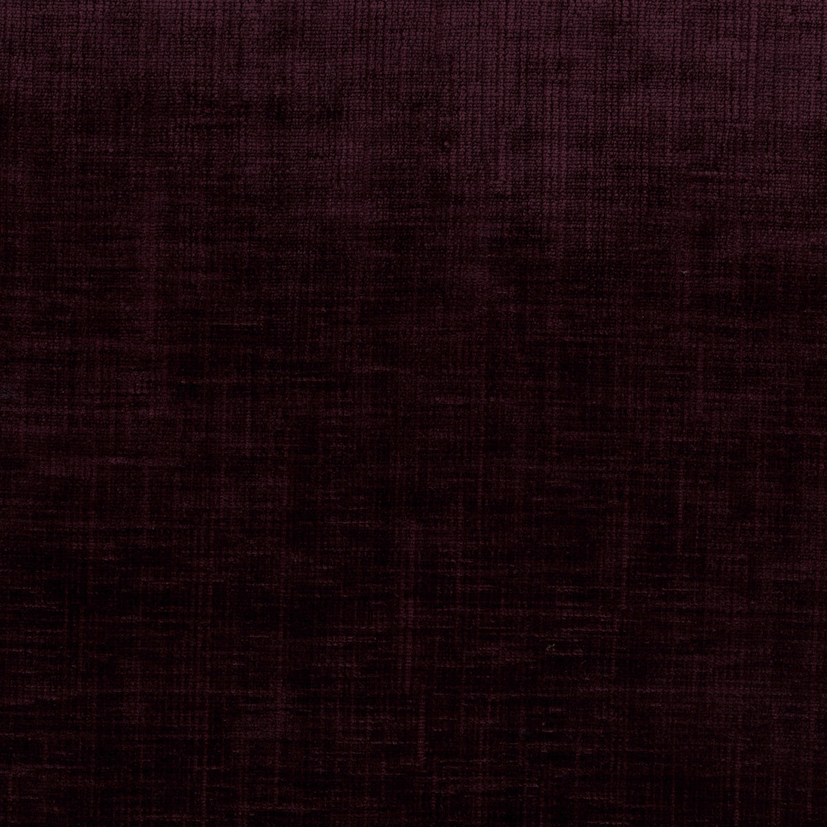 A close-up of a dark plum purple textured fabric with a subtle woven pattern.