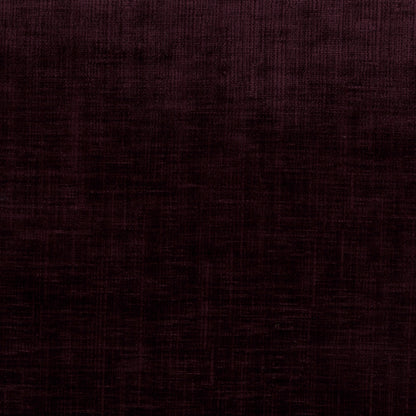 A close-up of a dark plum purple textured fabric with a subtle woven pattern.