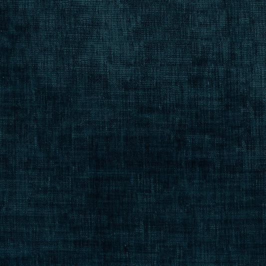 A close-up of dark teal blue textured fabric with a fine woven or linen-like pattern.
