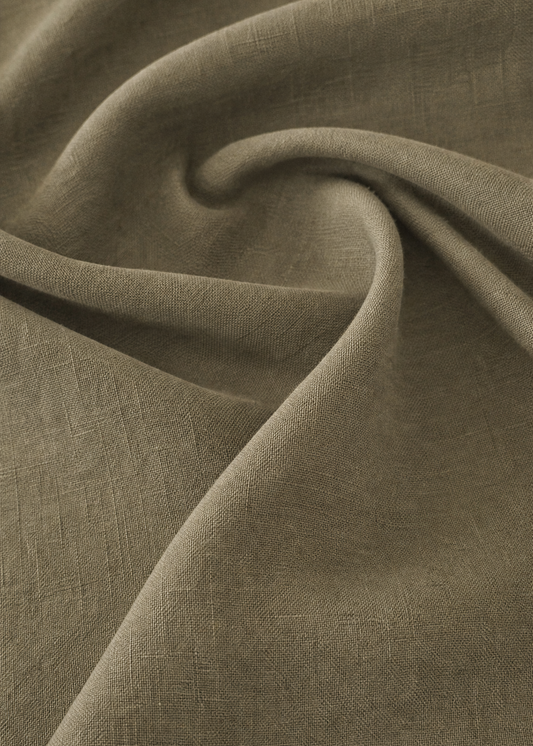 Close-up of brown fabric with folds