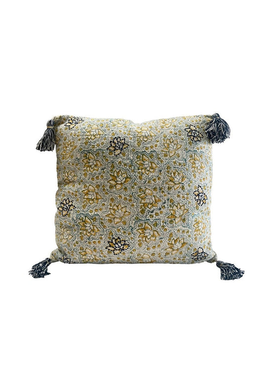Decorative pillow with floral pattern and tassels on a white background