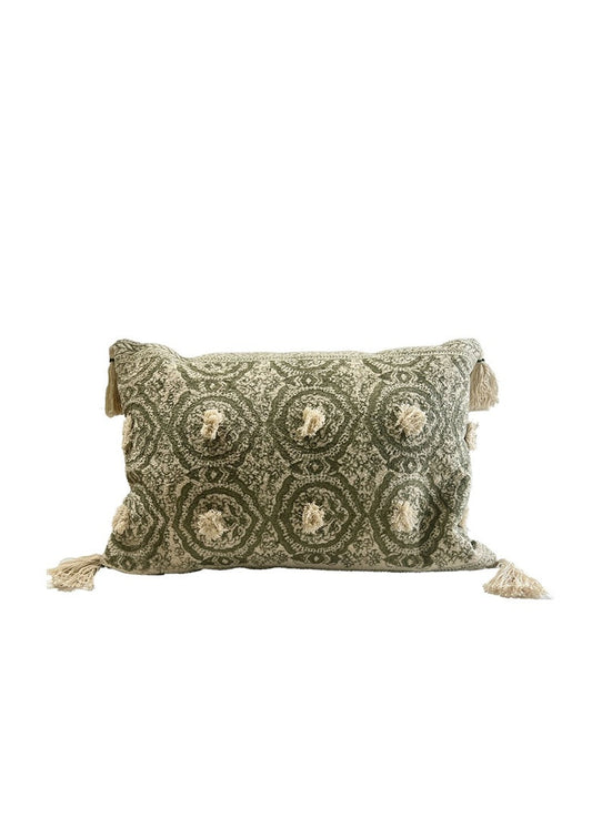 Decorative pillow with intricate pattern and tassels on a white background