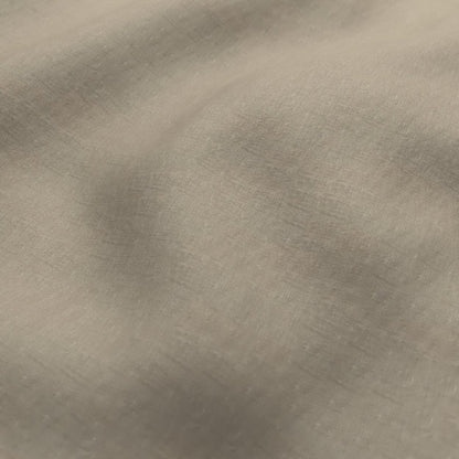 A close-up of a textured fabric with a soft, brushed metallic finish in a warm taupe or champagne color.