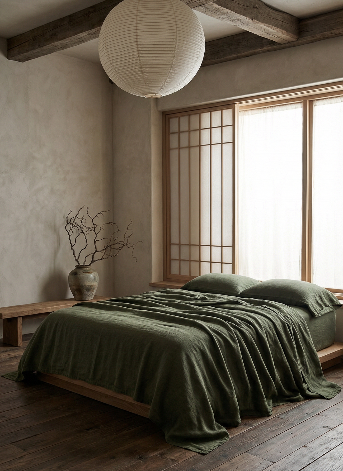Bedroom with green bedding, wooden floor, and large window