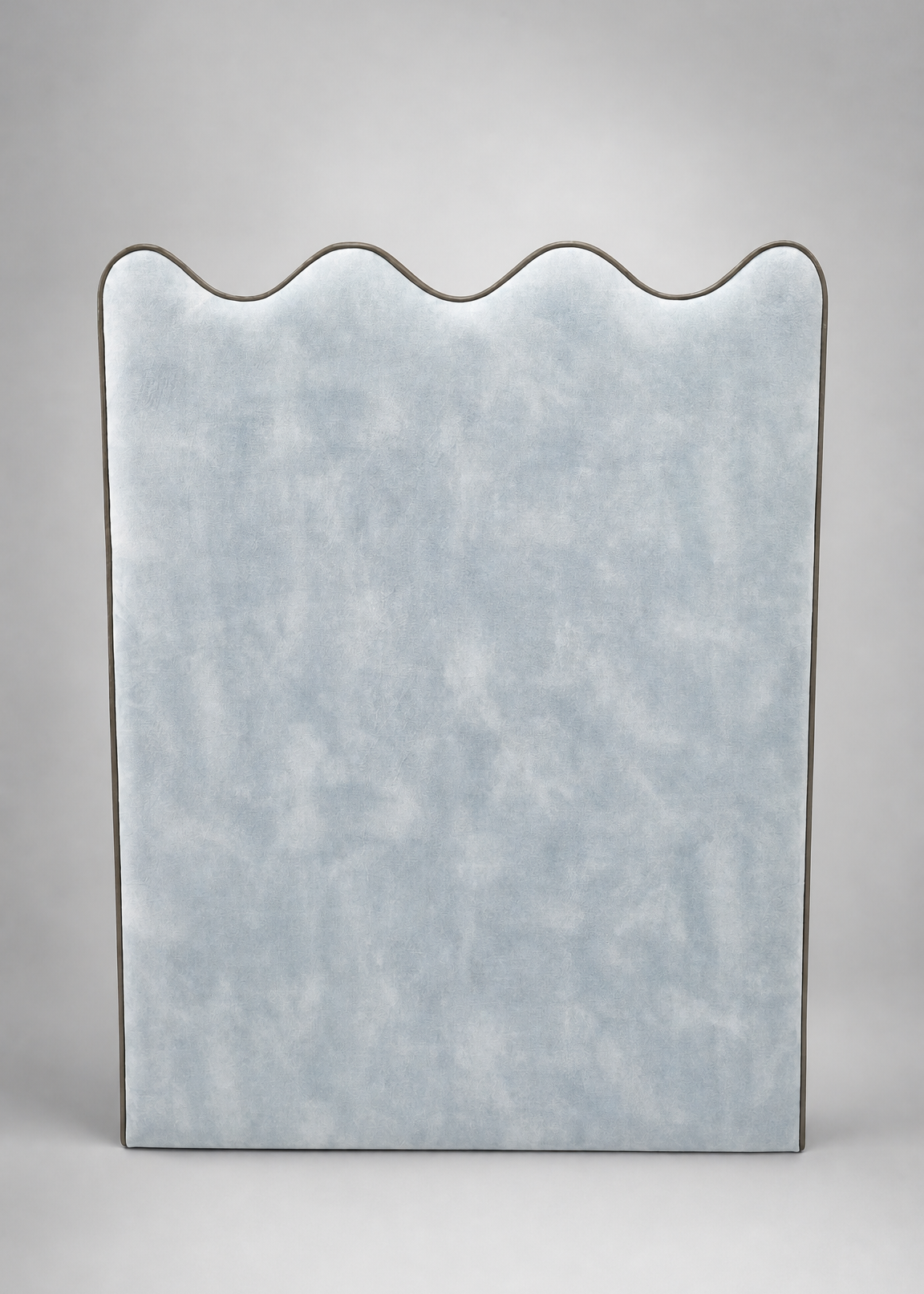 Rectangular mirror with wavy edge on a gray background