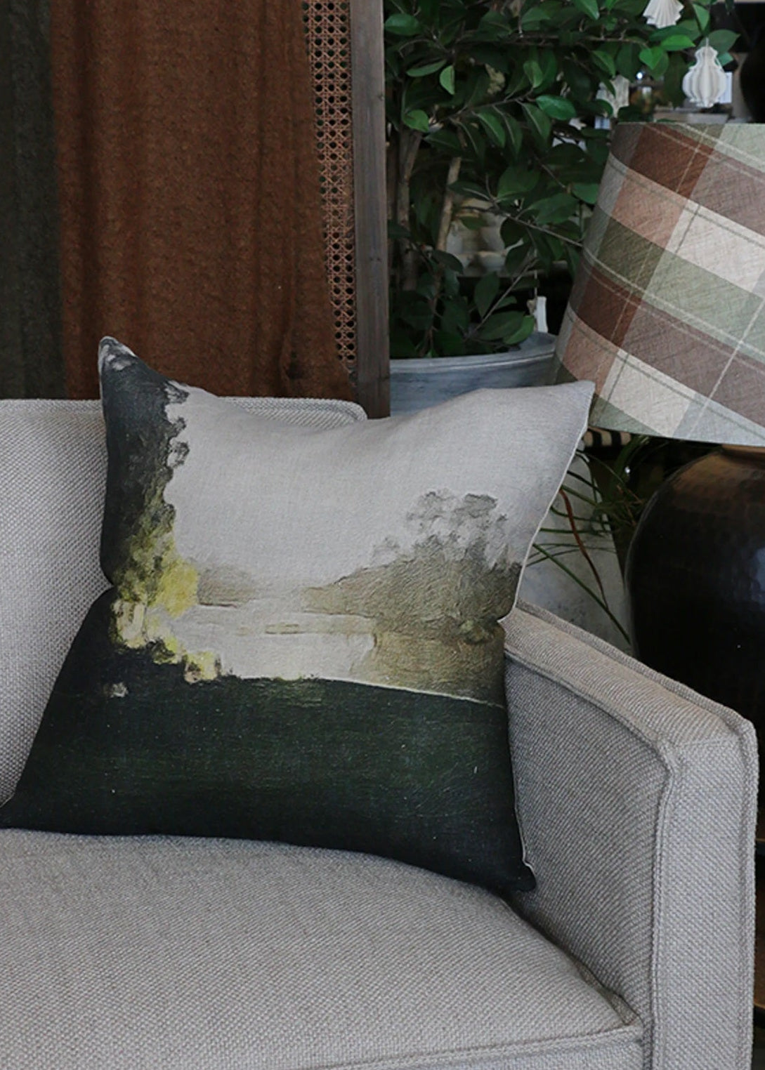 Decorative pillow on a gray sofa with a blurred background