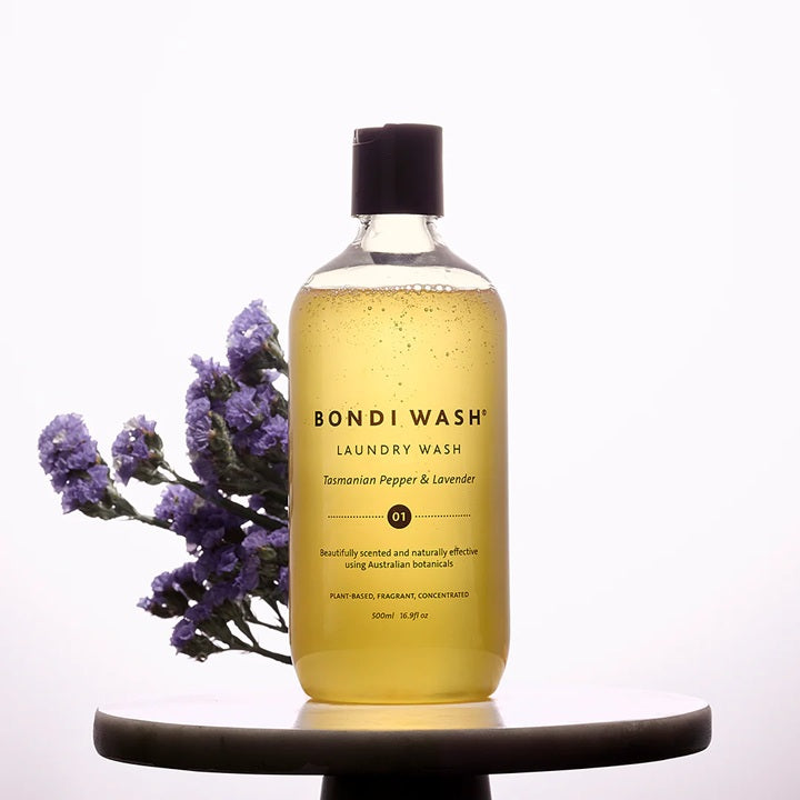 Bottle of Bondi Wash laundry wash with lavender flowers on a white background