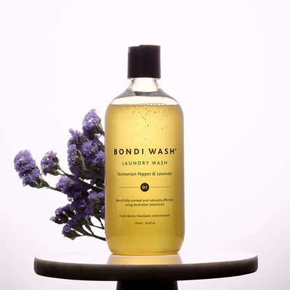 Bottle of Bondi Wash laundry wash with lavender flowers on a white background