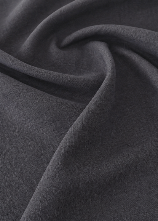 Close-up of dark gray fabric with folds