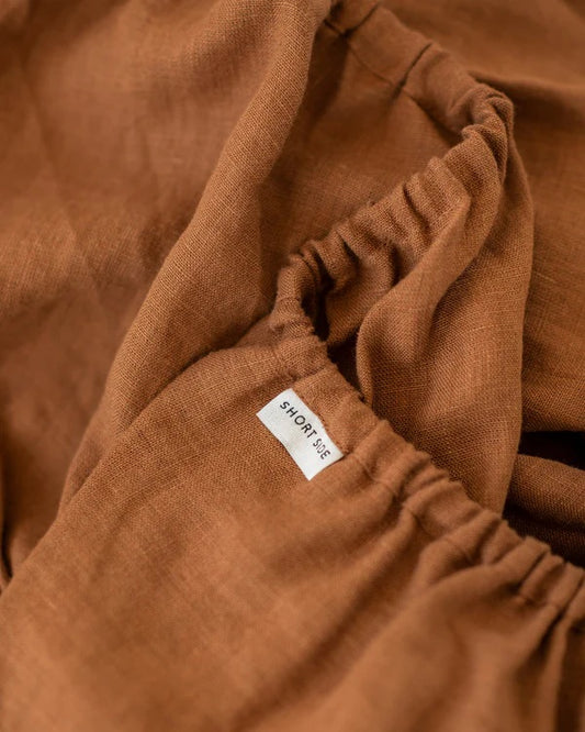 Brown fabric with a brand label on a close-up shot