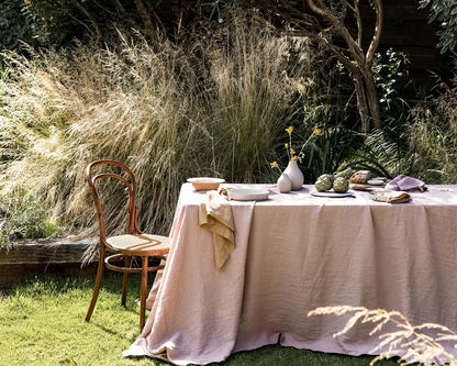 Outdoor setting with a table set for a meal in a garden
