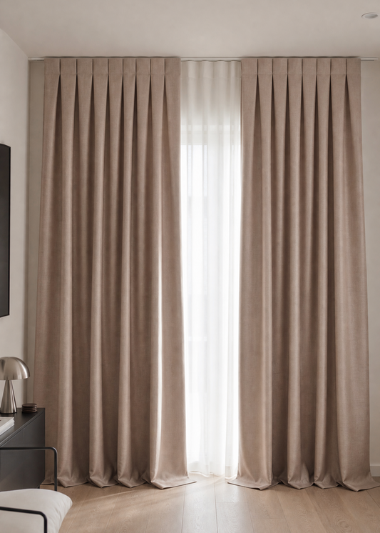 Beige curtains in a room with a light background