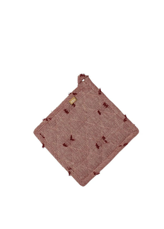 Pink textured fabric square with embroidered details on a white background