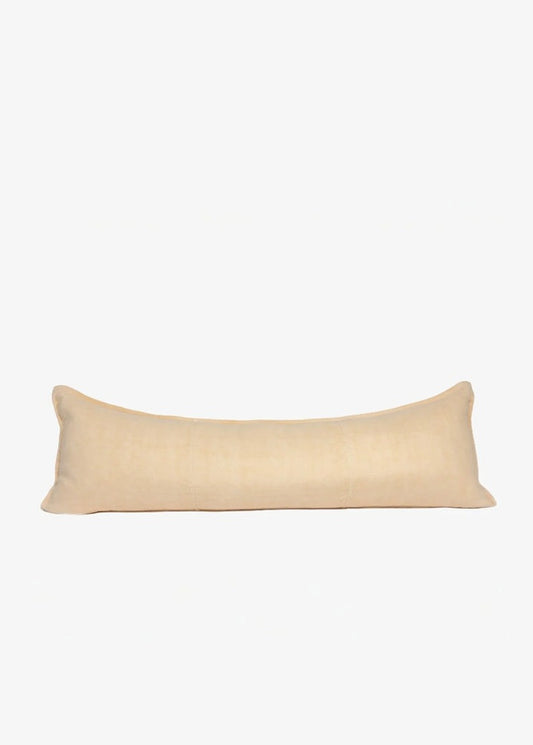 A long, rectangular lumbar pillow in a light beige linen fabric, shown against a plain white background.
