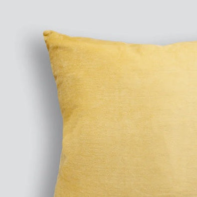 Yellow pillow on a light gray background