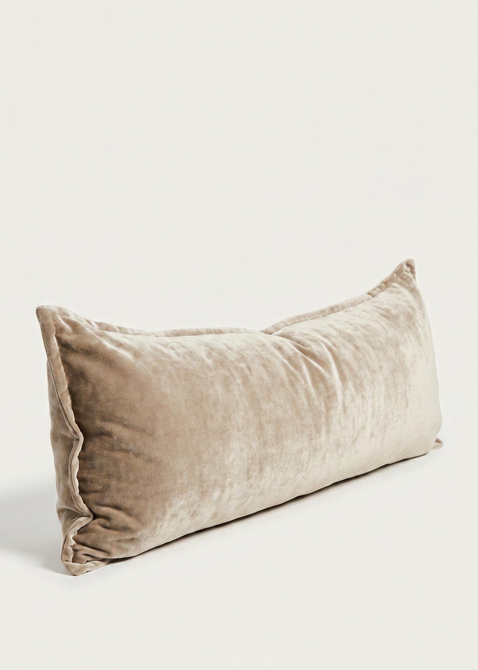 Beige velvet pillow on a light beige background