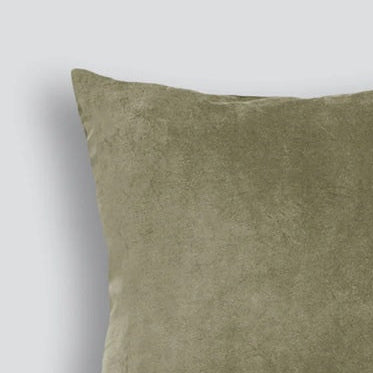Green cushion on a light gray background