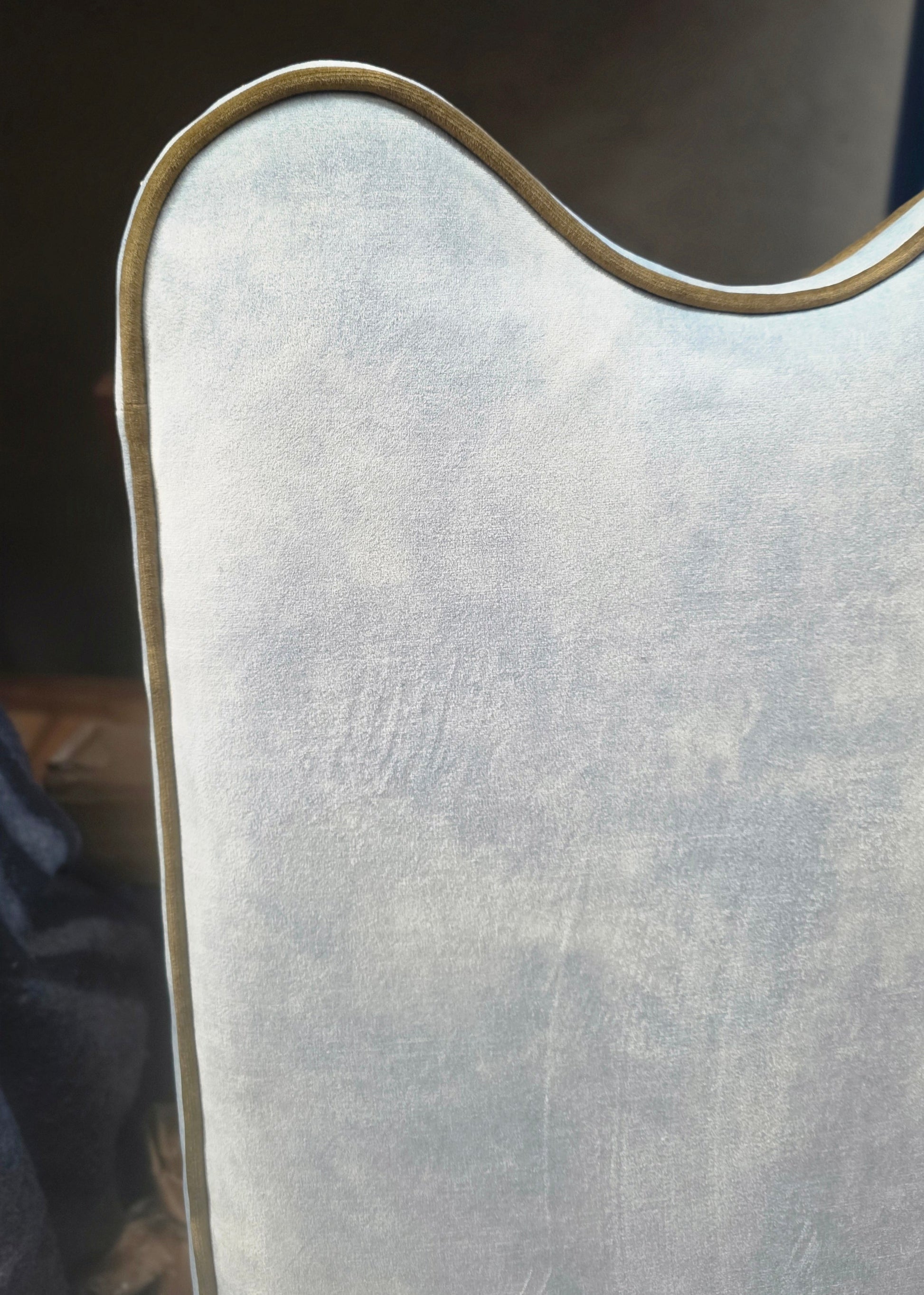Close-up of a guitar body with a worn finish