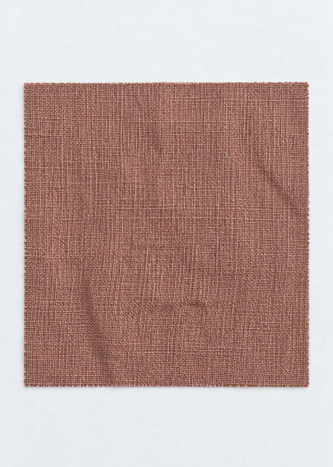 A square fabric swatch with a textured, woven linen-like pattern in a muted terracotta or dusty rose-brown color, presented on a clean white background.