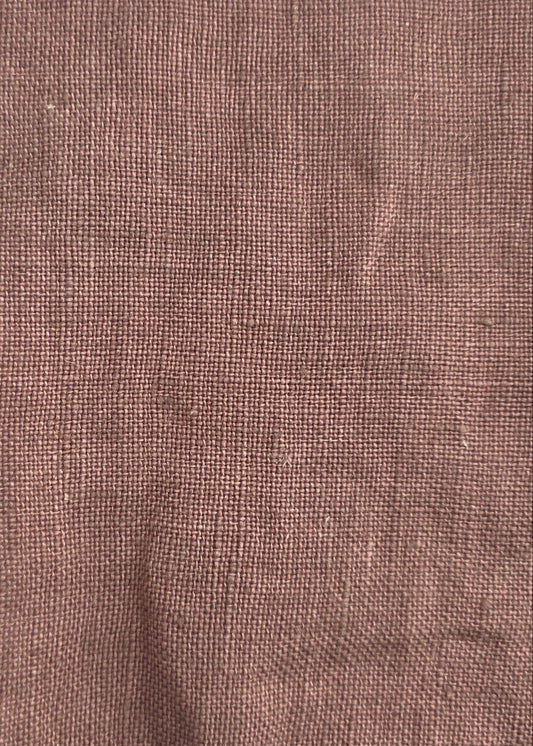 A square piece of textured brown linen fabric with frayed edges, laid flat on a light gray background.