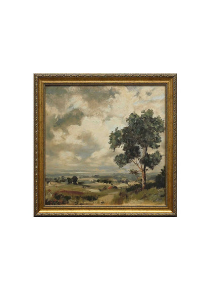 Framed landscape painting with a tree and open field on a white background