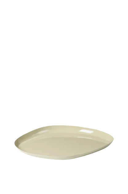 Beige ceramic plate on a white background