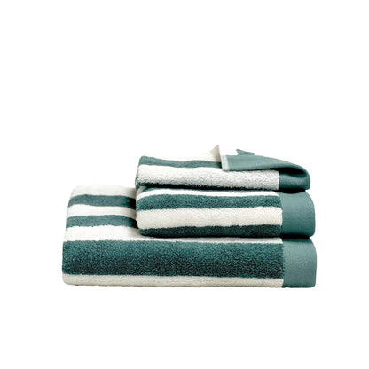 A stack of three striped bath towels in teal green and white, arranged neatly on a solid white background.
