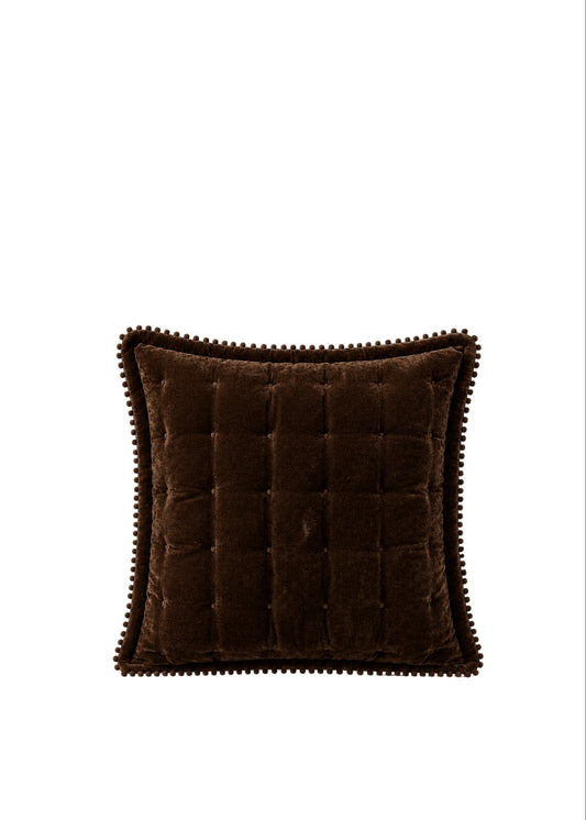 A square brown velvet throw pillow with a tufted center and a decorative scalloped edge, shown against a plain white background.