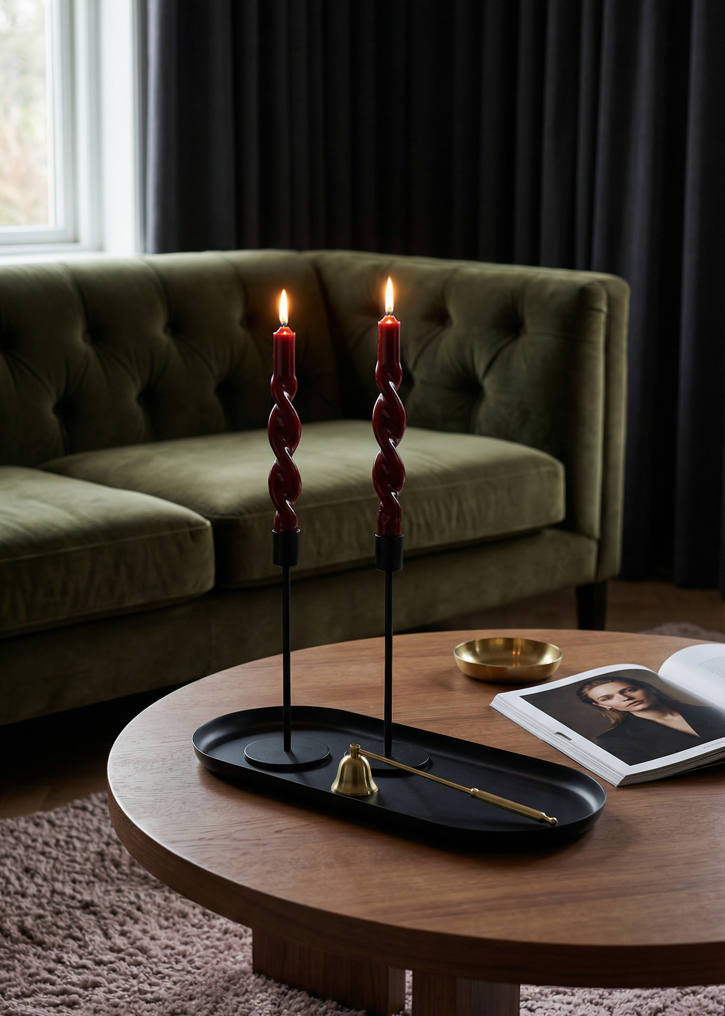 Living room with a green sofa, wooden coffee table, and decorative items.