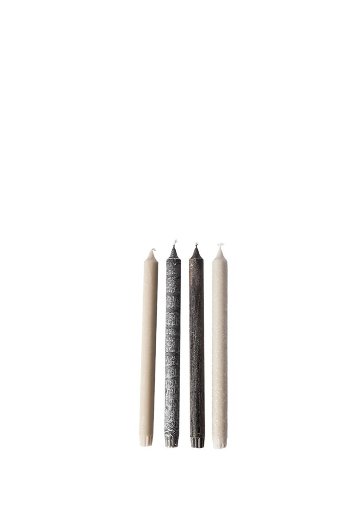 Three candles of different colors on a white background