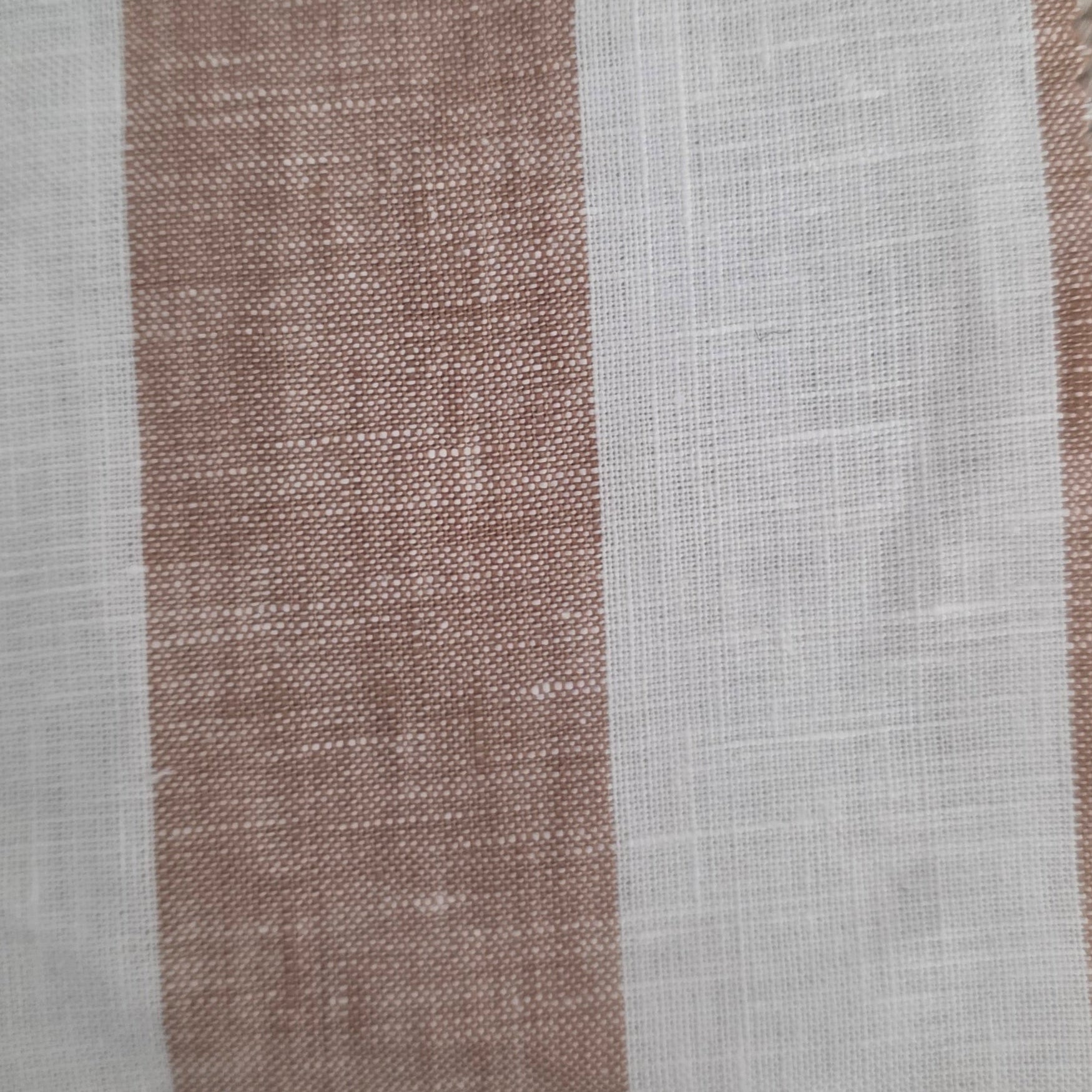 Textile sample with a label on a textured surface