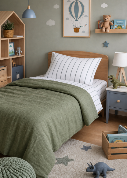 Children's bedroom with green bedding, wooden bookshelf, and toys on a star-patterned rug.
