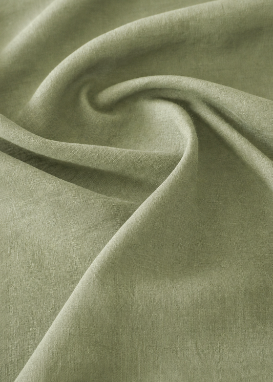 Close-up of green fabric with folds