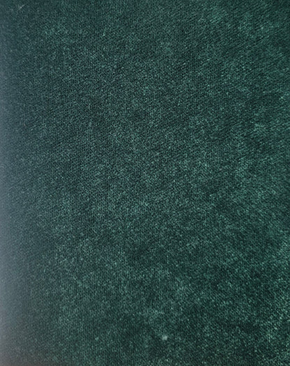 Close-up of a textured green fabric surface