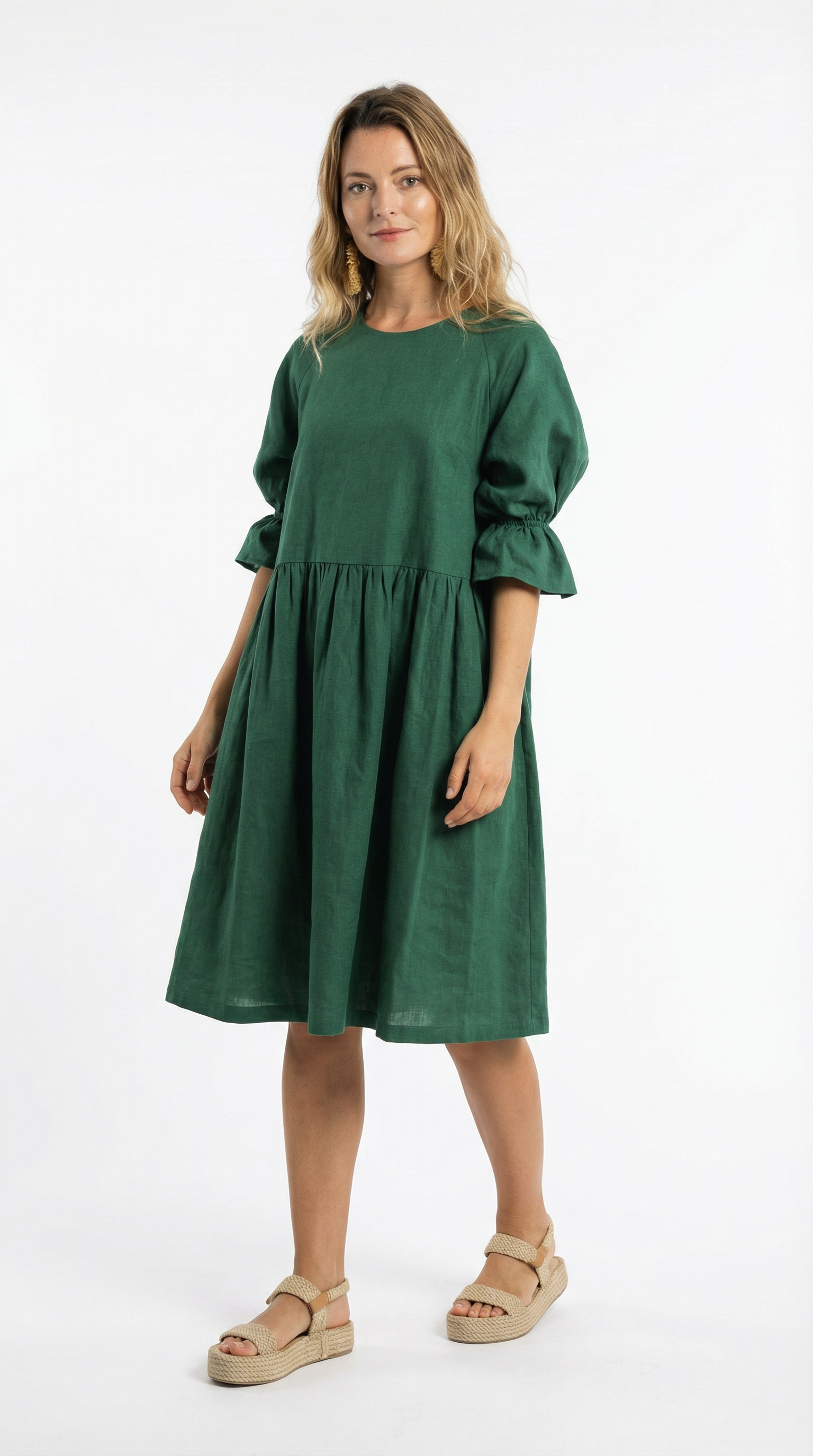 Woman wearing a green dress on a white background
