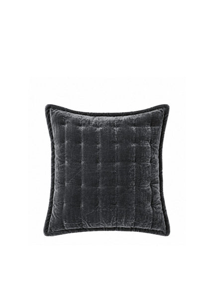 A square dark gray velvet throw pillow with a quilted channel tufted pattern and piped edges, shown against a plain white background.