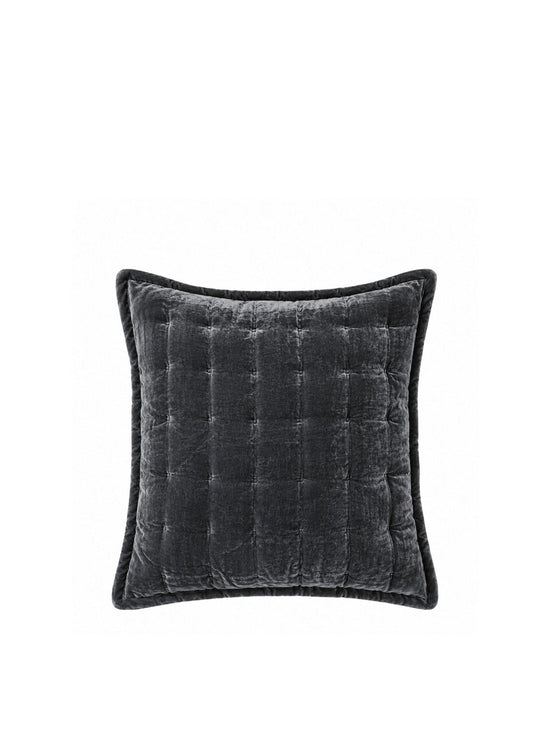 A square dark gray velvet throw pillow with a quilted channel tufted pattern and piped edges, shown against a plain white background.